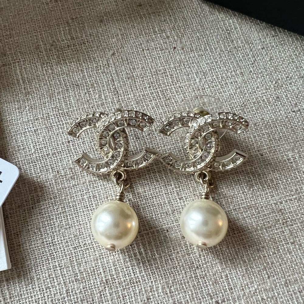 NWT authentic Chanel Pearl and crystal earrings.